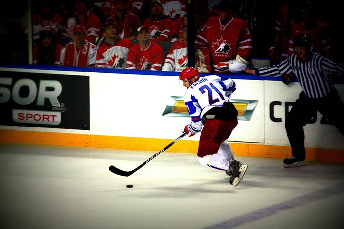 Russian Hockey Player with Puck