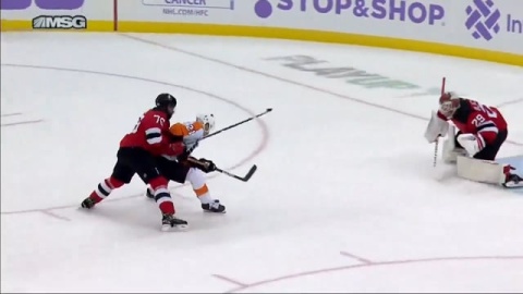 Laughton Protects the Puck While Driving to the Net